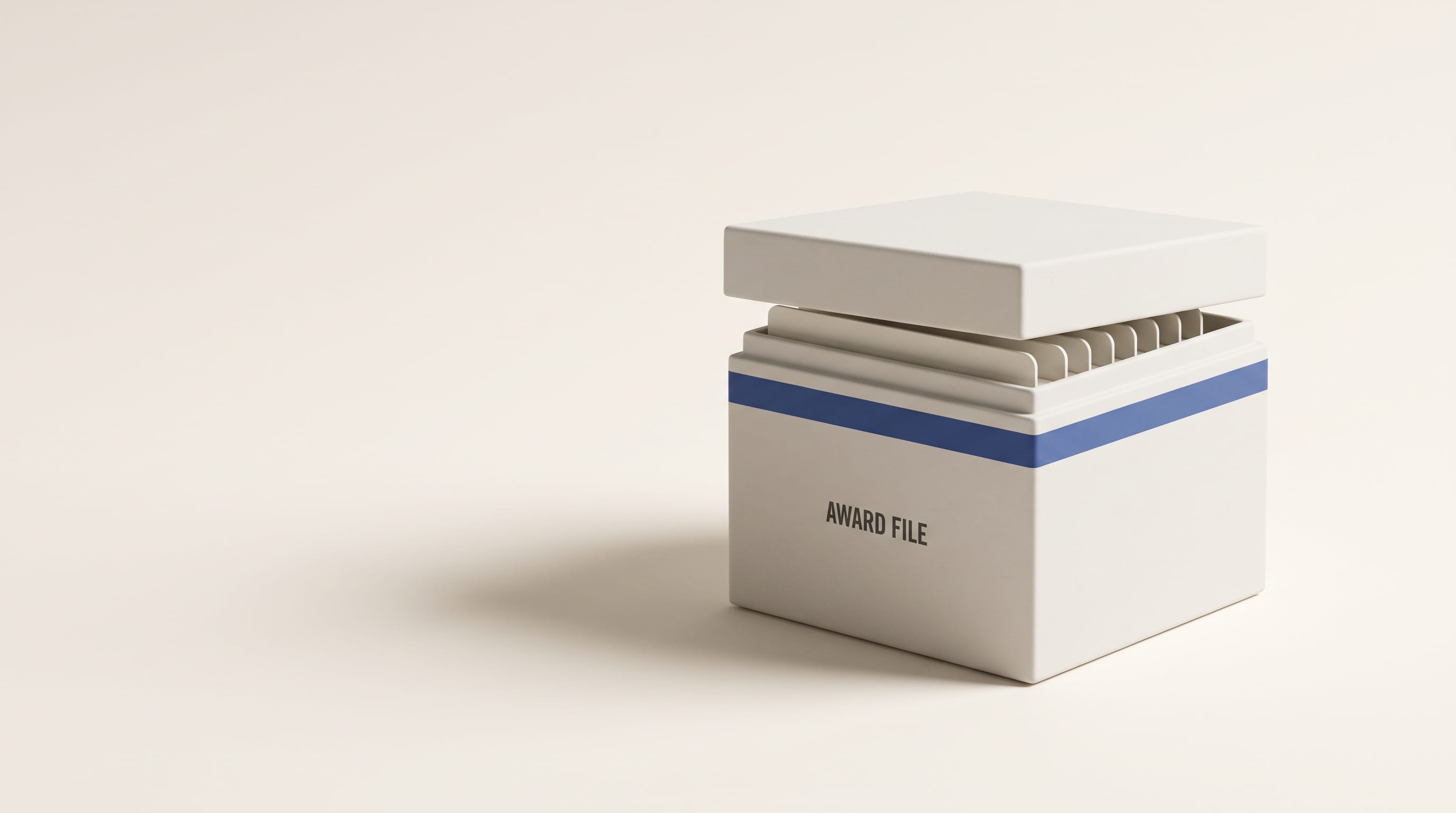 A porcelain archive box reading AWARD FILE, its lid set ajar over filed dividers, with one royal blue band around it